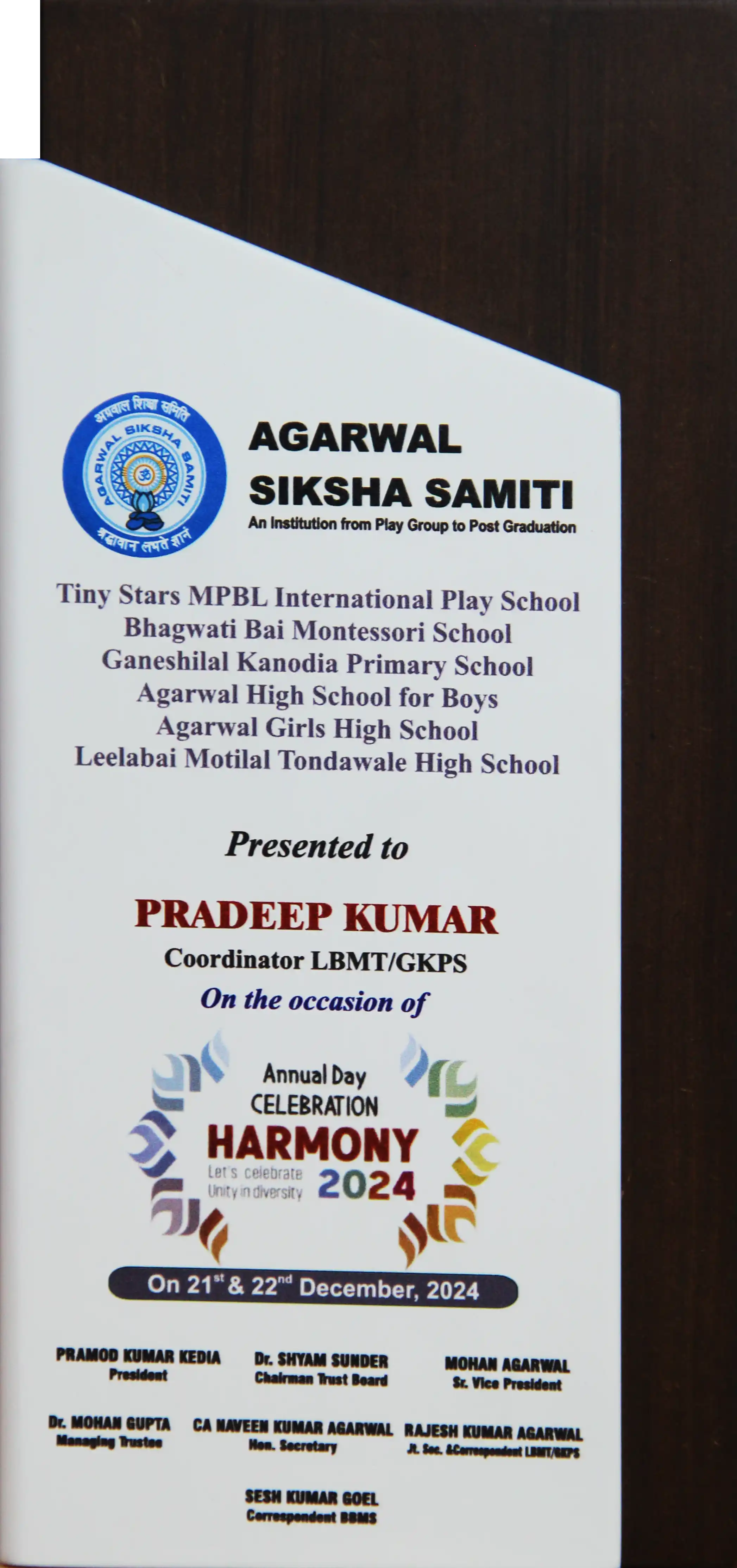 Agarwal Siksha Samiti certificate presented to Pradeep Kumar for coordinating Harmony 2024 annual day celebration